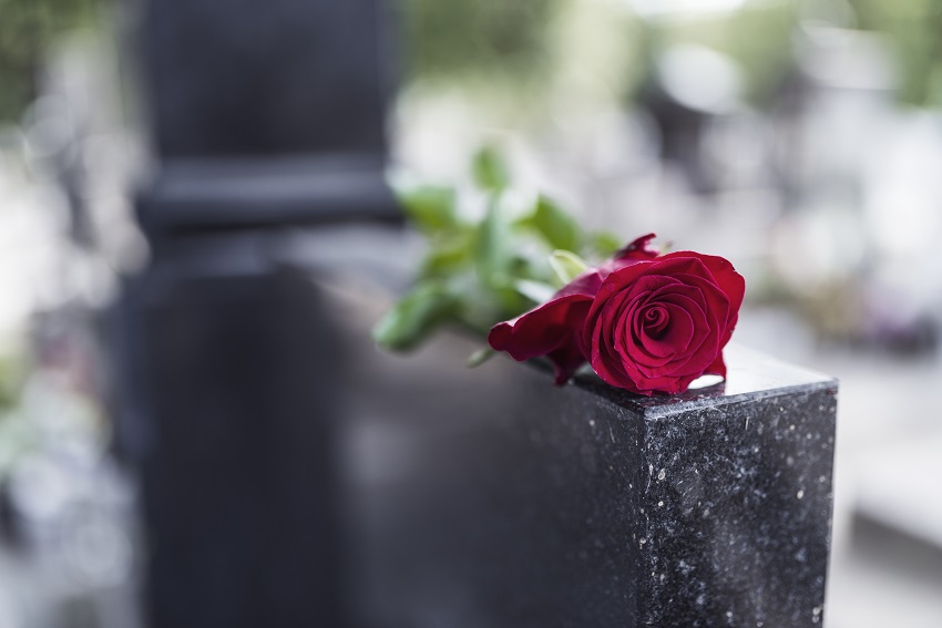 Rose on tombstone.