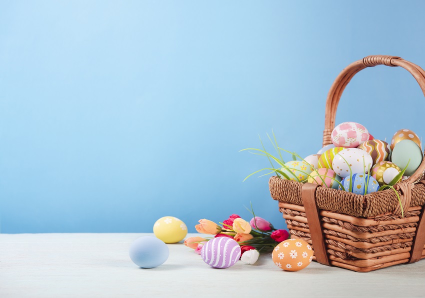 Happy easter, Easter painted eggs in the basket on wooden rustic